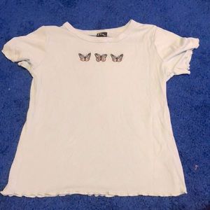 This is a ribknit shirt with three butterfly’s